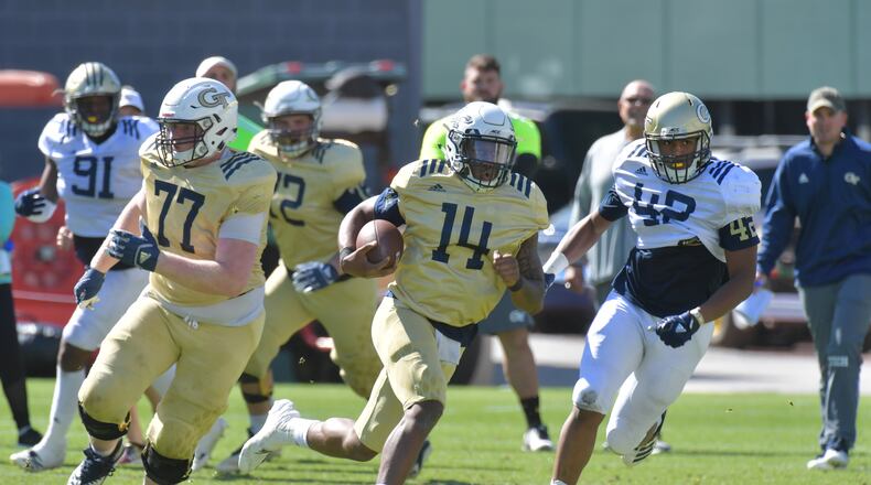 Georgia Tech quarterback James Graham (14) has open field ahead. HYOSUB SHIN / HSHIN@AJC.COM