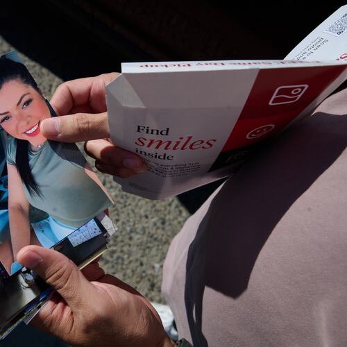 Army Staff Sgt. Alexis Jaramillo shows photos of his wife, Maisa Lopes Eliaser, a Brazilian national who is detained by ICE, near the South Louisiana ICE Processing Center where she is currently held, in Basile, La., Sunday, Aug. 2, 2026. (AP Photo/Joseph Vidrine)