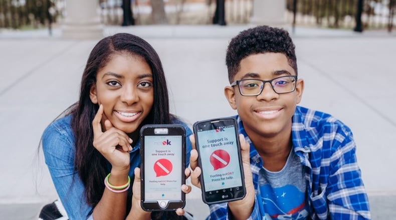 Hannah and Charlie Lucas of Cumming created the notOK app, a digital panic button that can summon a designated list of people when you’re in distress. CONTRIBUTED BY VANIA STOYANOVA