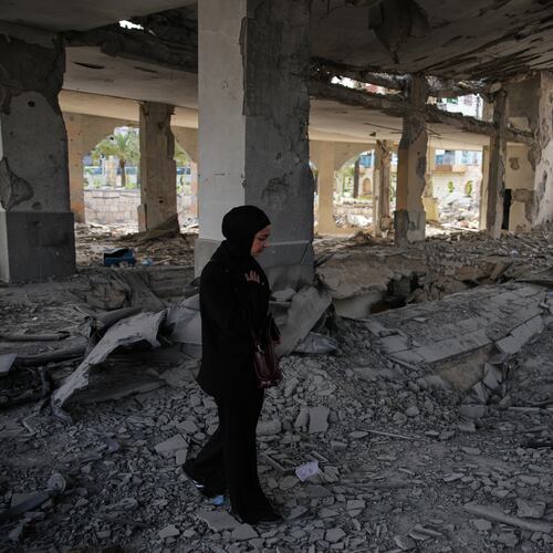 A local resident walks among debris inside a mosque destroyed in an Israeli airstrike in Jibchit, southern Lebanon, Friday, April 17, 2026, following a ceasefire between Israel and Hezbollah. (AP Photo/Hassan Ammar)