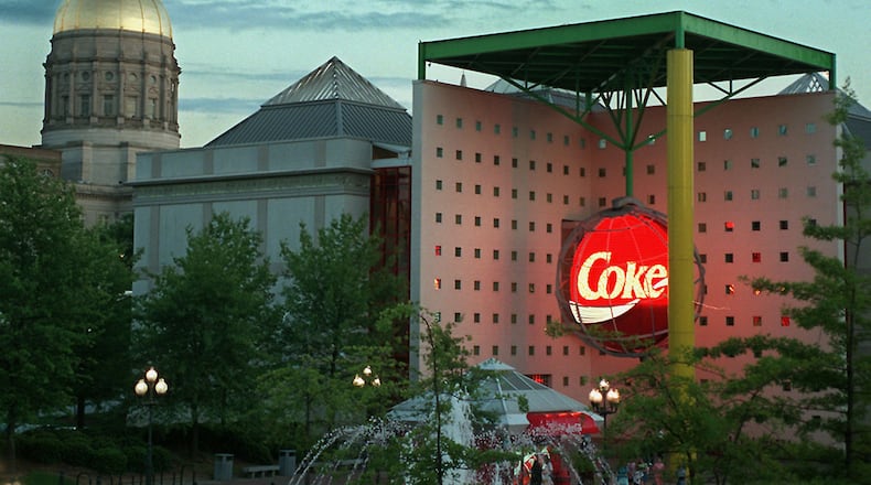The World of Coca-Cola: This large circular sign hung over the entrance at The World of Coca-Cola's original location near the Capitol when the museum opened in 1990. (CHARLOTTE B. TEAGLE / AJC file)