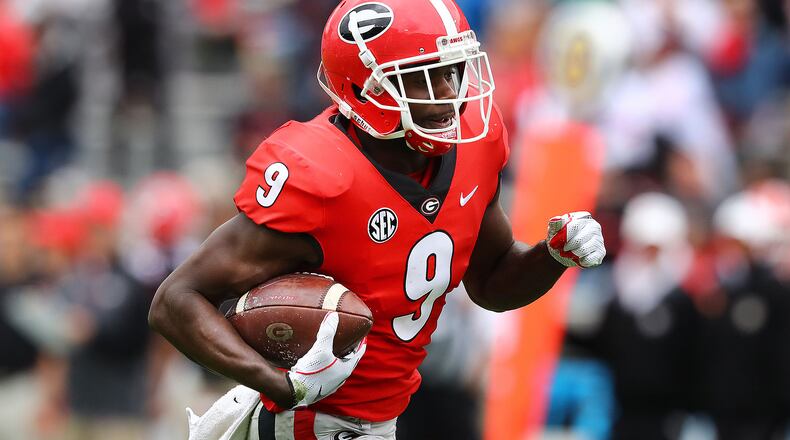 Georgia wide receiver Jeremiah Holloman breaks away for a touchdown after the reception during the annual G-Day football game on Saturday, April 20, 2019, in Athens. (Curtis Compton/ccompton@ajc.com)