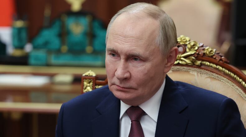 Russian President Vladimir Putin listens to Vitaly Mutko, the chief executive officer of Dom.RF, not pictured, during their meeting at the Kremlin in Moscow, Russia, on Monday, Oct. 20, 2025. (Alexander Kazakov, Sputnik, Kremlin Pool Photo via AP)