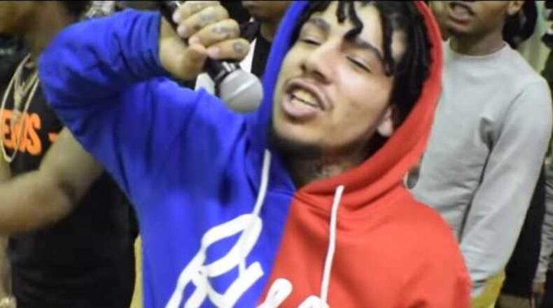 Drugrixh Hect, shown performing what turned out to be an unsanctioned show at Salem Middle in DeKalb County, is headed to prison in a robbery case.