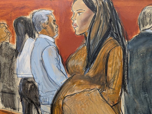 Cassie Ventura, right, walks out of the courtroom past Sean Diddy Combs after testifying in Manhattan federal court, Tuesday, May 13, 2025, in New York. (Elizabeth Williams via AP)