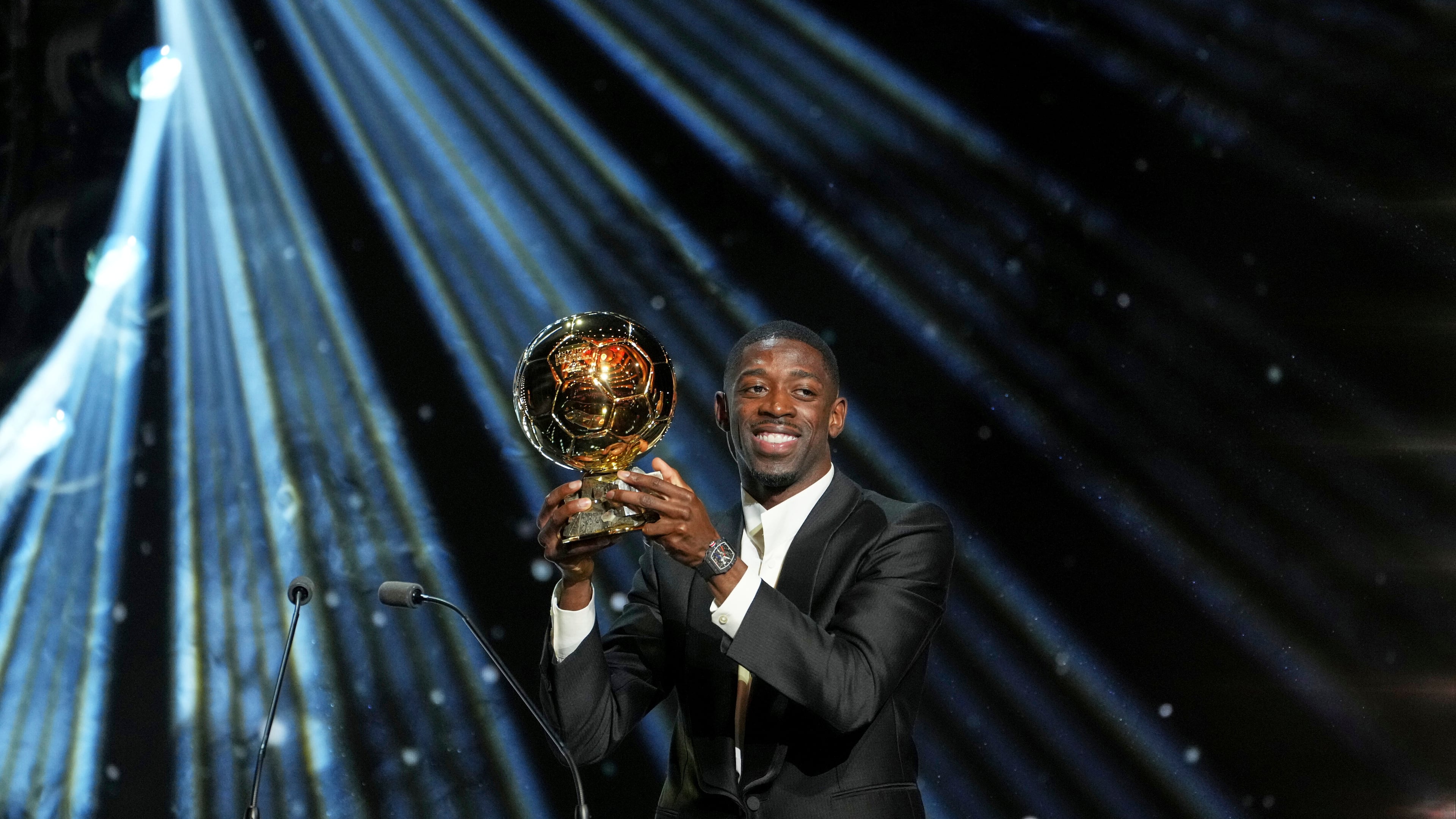 Paris Saint-Germain's Ousmane Dembélé receives the 2025 Men's Ballon d'Or during the 69th Ballon d'Or awards ceremony at the Theatre du Chatelet in Paris, Monday, Sept. 22, 2025. (AP Photo/Thibault Camus)