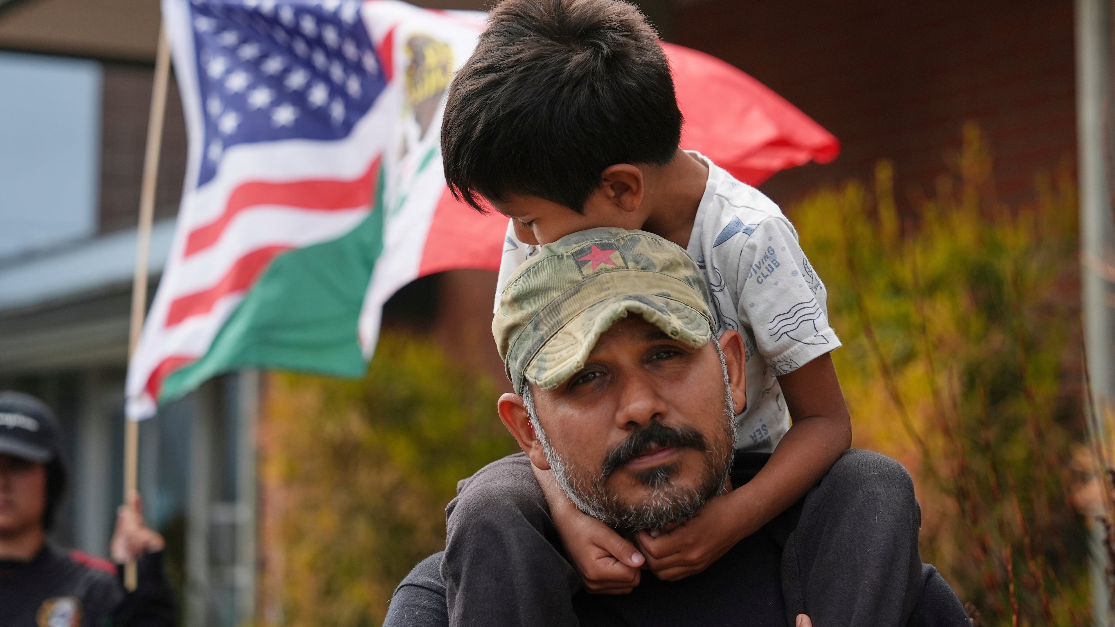 FILE - Gerardo Santos lifts his son Xavier, 5, on his shoulders during a protest in reaction to immigration raids, July 11, 2025, in Oxnard, Calif. (AP Photo/Jae C. Hong, File)