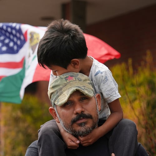 FILE - Gerardo Santos lifts his son Xavier, 5, on his shoulders during a protest in reaction to immigration raids, July 11, 2025, in Oxnard, Calif. (AP Photo/Jae C. Hong, File)