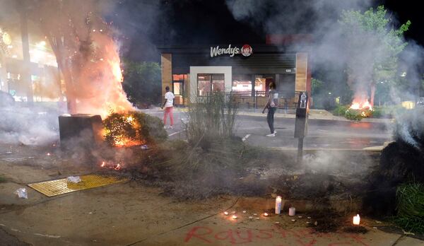 Protesters gather at the University Avenue Wendy's where Rayshard Brooks, a 27-year-old Black man, was shot and killed by Atlanta police on June 12, 2020, during a struggle in the drive-thru line.