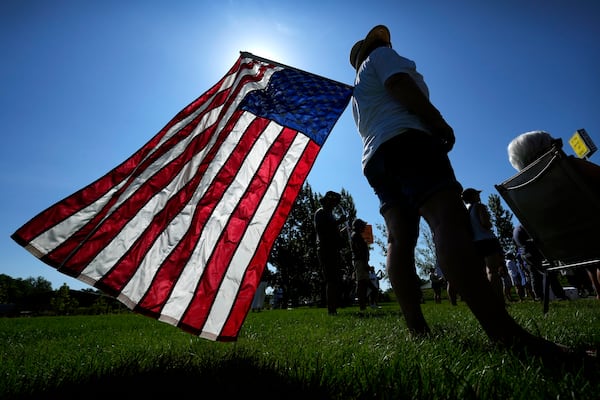 Theresa Peiffer, of Polk City, Iowa, listens to a speaker during an Iowa Democratic Party rally, Thursday, July 3, 2025, in Windsor Heights, Iowa. (AP Photo/Charlie Neibergall)