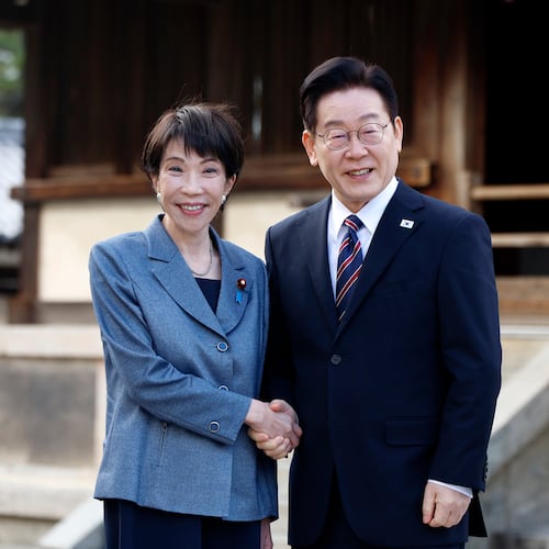 Japanese Prime Minister Sanae Takaichi, left, and South Korean President Lee Jae Myung pose for photographs as they visit the Western Precinct or Saiin Garan, at the Horyuji Temple in Ikaruga, Nara prefecture, western Japan, Wednesday, Jan. 14, 2026. (Franck Robichon/Pool Photo via AP)