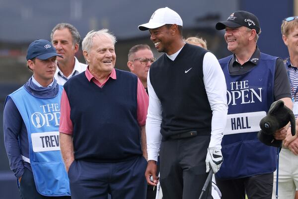 FILE - Tiger Woods and Jack Nicklaus, chat during a "Champions roudd" as preparations continue for the British Open golf championship on the Old Course at St. Andrews, Scotland, Monday July 11, 2022. (AP Photo/Peter Morrison, File)