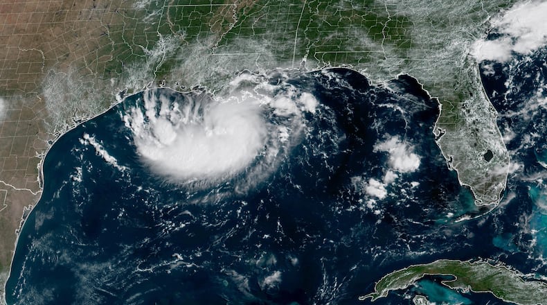 This satellite image released by NOAA shows Potential Tropical Cyclone Five forming over the Gulf of Mexico on Monday, Aug. 31, 2026. (NOAA via AP)