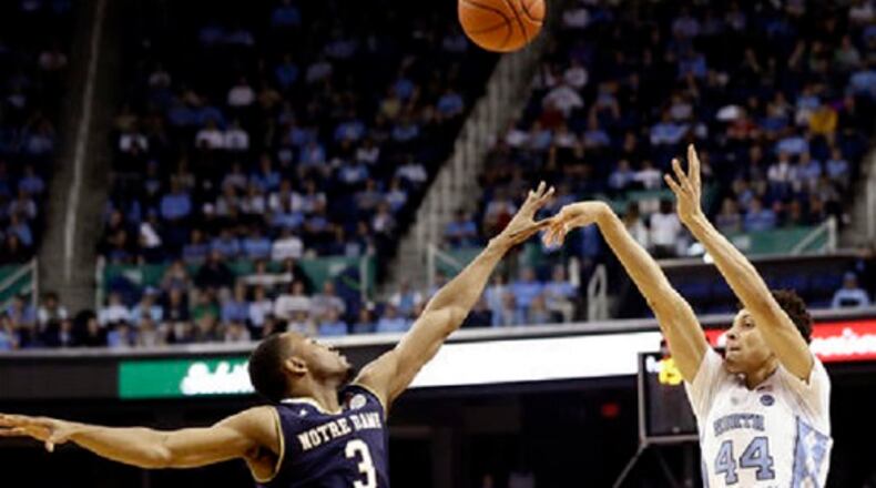 North Carolina's Justin Jackson (44) shoots over Notre Dame's V.J. Beachem (3) during the first half of an NCAA college basketball game in Greensboro, N.C., Sunday, Feb. 5, 2017. (AP Photo/Gerry Broome)