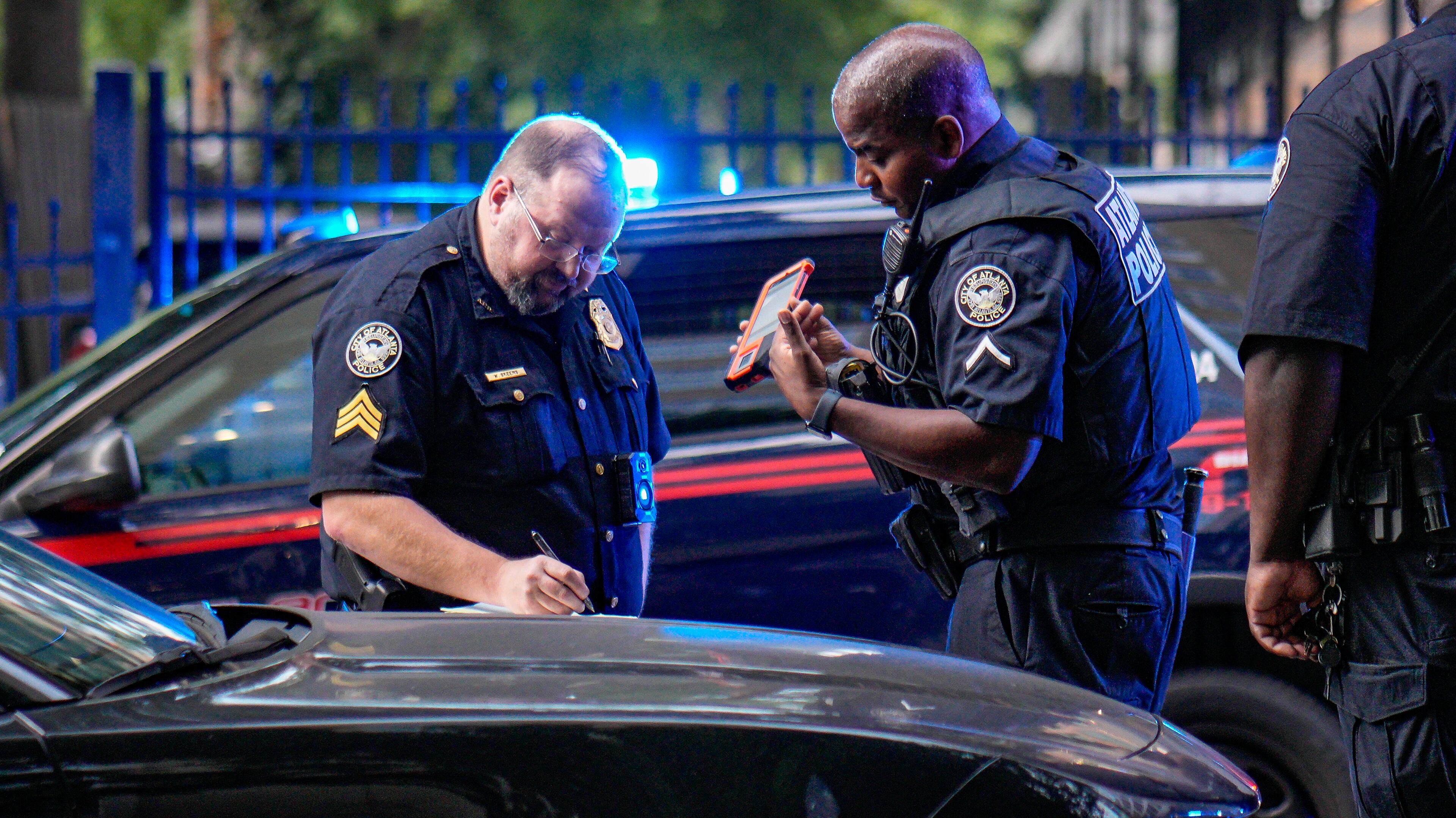 Atlanta police investigate a fatal stabbing at the Piedmont Arbors condominium near Midtown's rainbow crosswalk on July 8. The violent crime rate in Georgia has been declining. (Ben Hendren for the AJC)