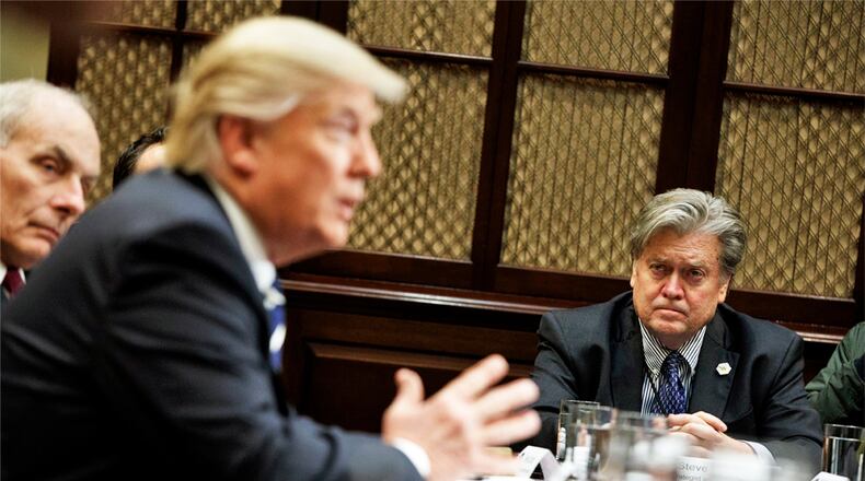 White House Chief Strategist Steve Bannon listens at right as President Donald Trump speaks during a meeting on cyber security in the Roosevelt Room of the White House in Washington, Tuesday, Jan. 31, 2017. (AP Photo/Evan Vucci)