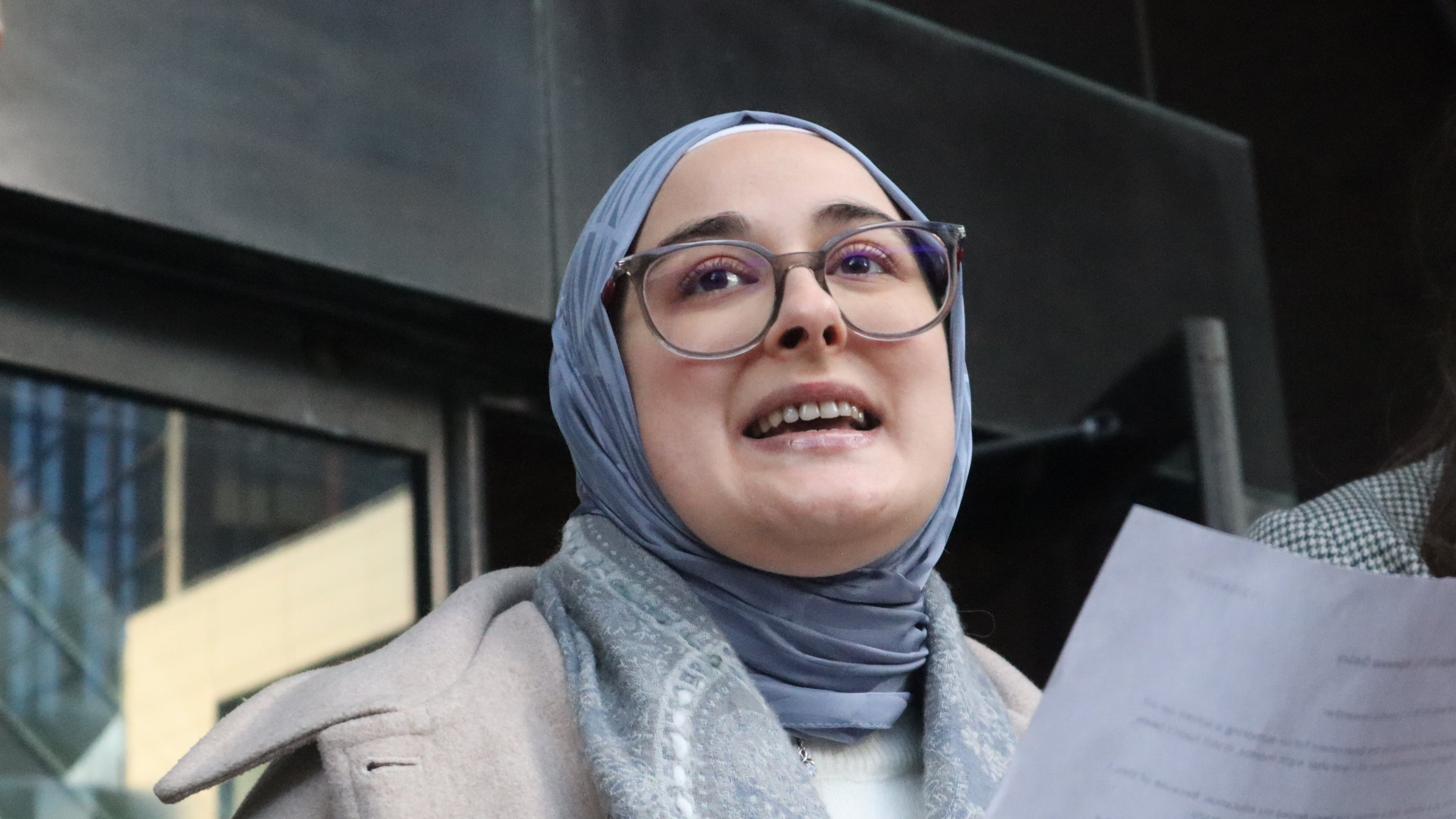 Tufts University doctoral student Rumeysa Ozturk reads from a prepared statement following a court hearing outside the John Joseph Moakley United States Courthouse Thursday, Dec. 4, 2025, in Boston. (AP Photo/Leah Willingham)