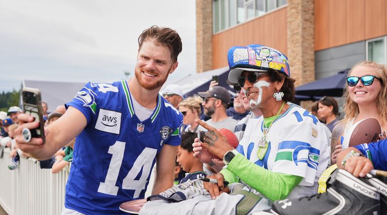 Seattle Seahawks quarterback Sam Darnold takes a selfie during the NFL football team's training camp, Sunday, July 26, 2026, in Renton, Wash. (AP Photo/Lindsey Wasson)