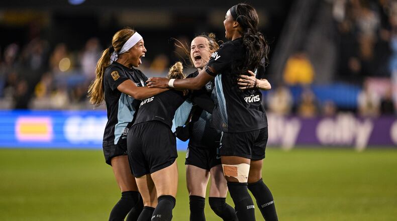 NJ/NY Gotham FC midfielder Rose Lavelle (16) is mobbed by her teammates after scoring a goal to take the lead during the second half of a NWSL women's championship soccer match against the Washington Spirit, Saturday, Nov. 22, 2025, in San Jose, Calif. (AP Photo/Justine Willard)