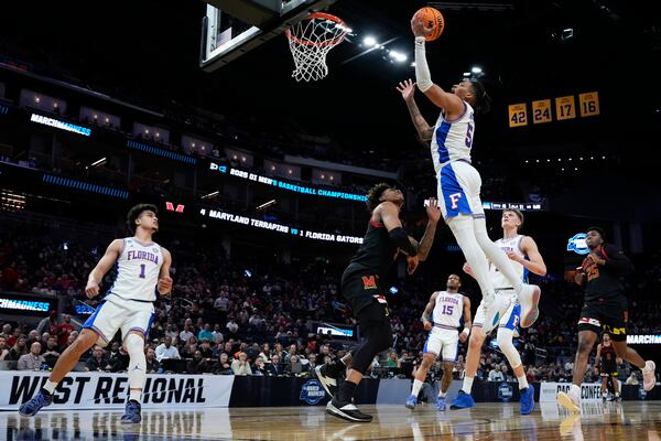 Florida guard Will Richard (5) shoots against Maryland guard DeShawn Harris-Smith during the first half in the Sweet 16 of the NCAA college basketball tournament, Thursday, March 27, 2025, in San Francisco. (AP Photo/Godofredo A. Vásquez)