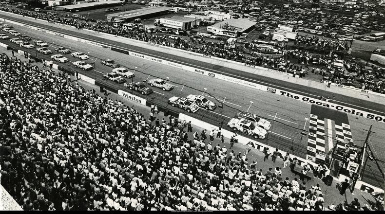 A crowd watches the start of the Atlanta Coca Cola 500, 1982. Ray West / AJC file