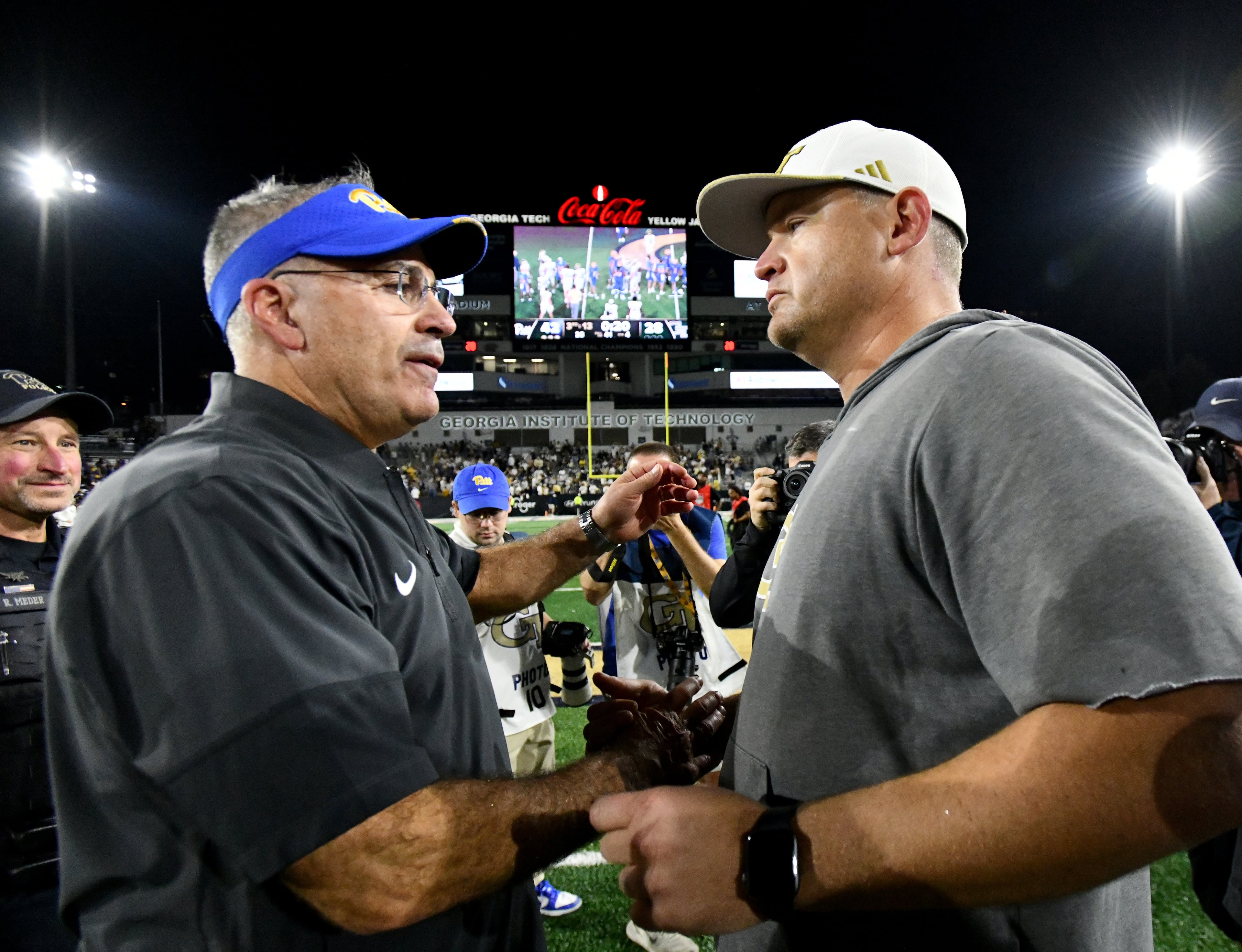 Georgia Tech head coach Brent Key and Pittsburgh head coach Pat Narduzzi shake hands after Pittsburgh beat Georgia Tech during an NCAA college football game at Bobby Dodd Stadium, Saturday, November 22, 2025 in Atlanta. Pittsburgh won 42-28 over Georgia Tech. (Hyosub Shin / AJC)