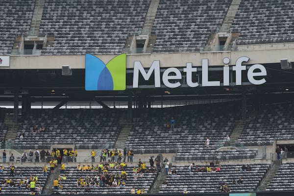 Fans take their seats for the Club World Cup group F soccer match between Fluminense and Borussia Dortmund in East Rutherford, N.J., Tuesday, June 17, 2025. (AP Photo/Seth Wenig)