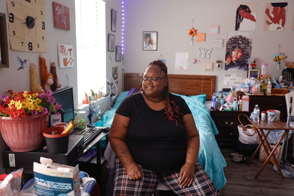 Tonisha Hines poses for a photo in her bedroom in her apartment in Scottdale, Ga. on Tuesday, Aug. 12, 2025. Hines currently receives permanent supportive housing through Claratel Behavioral Health’s residential services program.  (Natrice Miller/ AJC) 