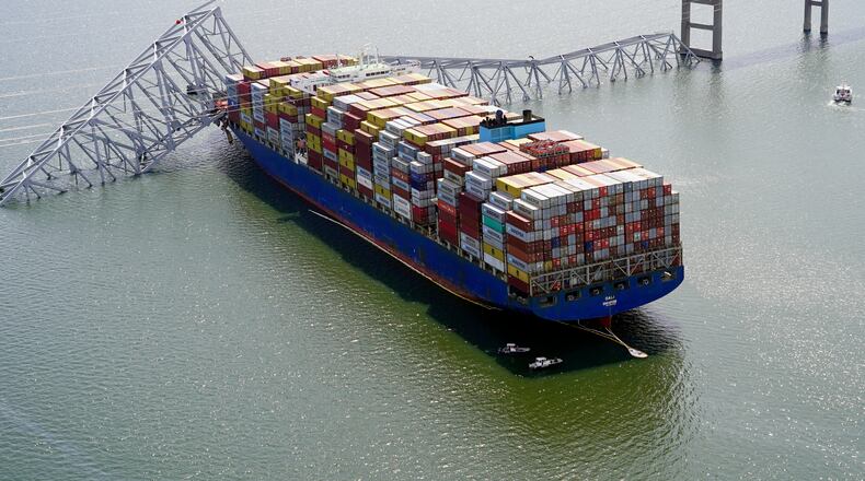FILE - In this photo provided by the Maryland National Guard, the cargo ship Dali is stuck under part of the structure of the Francis Scott Key Bridge after the ship hit the bridge March 26, 2024, in Baltimore. (Maryland National Guard via AP, File)