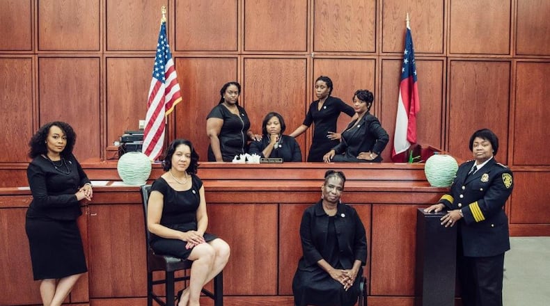 This photo went viral showing the eight African-American women who are leading the City of South Fulton’s law enforcement and municipal court system. They are, front row, left to right: City Solicitor LaDawn Jones, Court Administrator Lakesiya Cofield, Public Defender Viveca R. Famber Powell, Interim Police Chief Sheila Rogers. Back row, left to right: Clerk Kerry Stephens, Chief Judge Tiffany Carter Sellers, Clerk of Court Ramona Howard, Clerk Tiffany Kinslow. (Photo by Reginald Duncan, Cranium Creation)