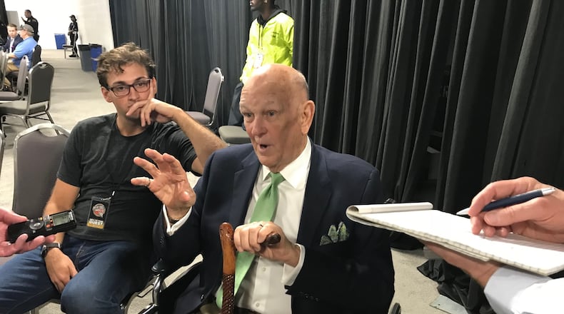 The Hall of Famer holds court. Grandson Walker Anderson listens.