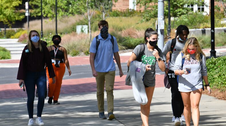 September 23, 2020 Athens - Students mostly wear face masks as they make their way through the campus in the University of Georgia campus in Athens on Wednesday, September 23, 2020. Maia Gibson was diagnosed with COVID near the start of the semester. She's okay now. Gibson now wants UGA to conduct more testing and enact other measures to reduce the spread of COVID-19 on the campus. (Hyosub Shin / Hyosub.Shin@ajc.com)