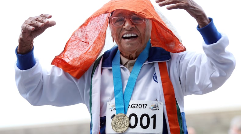Man Kaur, a 101-year-old runner from India, celebrates after winnig the 100-meter sprint in the 100+ age category at the World Masters Games at Trusts Arena in Auckland, New Zealand on April 24, 2017.