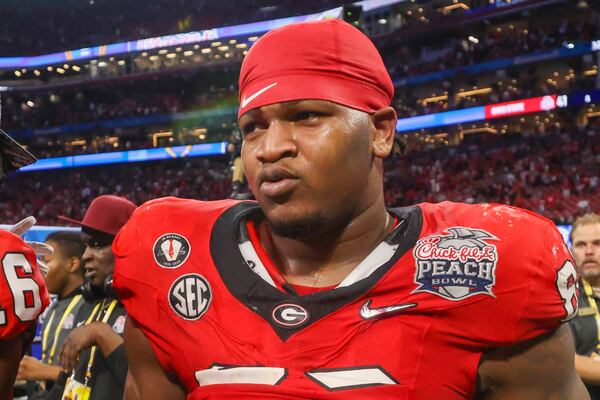 Georgia defensive lineman Jalen Carter (88) reacts after their win against Ohio State during the Peach Bowl Playoff Semifinal at Mercedes-Benz Stadium, Sat., Dec. 31, 2022, in Atlanta. Georgia won 42-41. (Jason Getz / Jason.Getz@ajc.com)