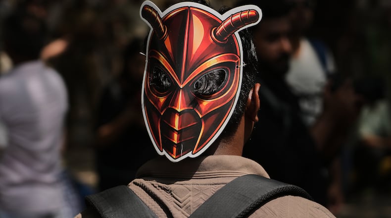 A participant wears a cockroach mask as supporters of the Cockroach Janta Party gather for a protest demonstration in New Delhi, India, Saturday, June 6, 2026. (AP Photo/Manish Swarup)