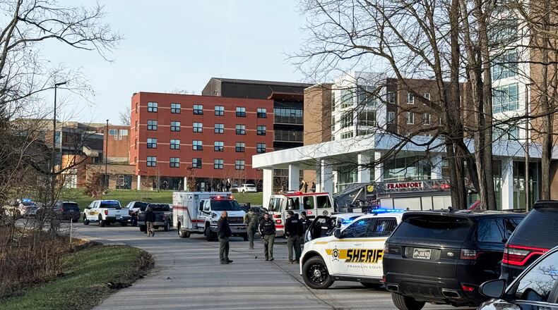 Law enforcement responds to a shooting at Whitney Moore Young Jr. Hall on Kentucky State University's campus in Frankfort, Ky., Tuesday, Dec. 9, 2025. (Hannah Brown/The State Journal via AP)