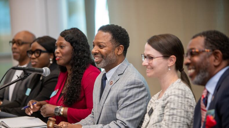 The first Mableton City Council Meeting takes place Thursday, May 11, 2023, at the Riverside Epicenter in Austell. City council members include Ron Davis, from left, Dami Oladapo, Keisha Jeffcoat, Mayor Michael Owens, Patricia Auch, Hoyt T.J. Ferguson and Debora Herndon, not shown. (Jenni Girtman for The Atlanta Journal-Constitution)