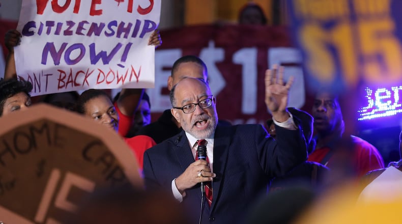 State Sen. Vincent Fort (D-Atlanta) speaks during a rally in front of Atlanta City Hall on November 10 to demand a $15-an-hour minimum wage. About 200 people showed up for the protest. Ben Gray / bgray@ajc.com