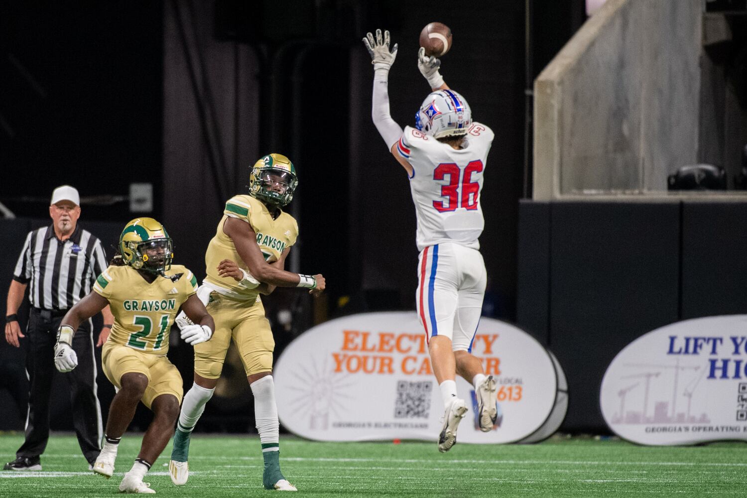 Hudson Beard, defensive back for Walton, blocks a pass by Grayson's quarterback, Jeff "JD" Davis. (Jamie Spaar for the Atlanta Journal Constitution)