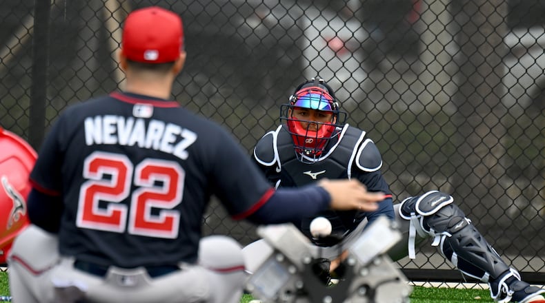 Atlanta Braves catcher Drake Baldwin practices with coach Wigberto Nevarez during spring training workouts at CoolToday Park, Sunday, February 16, 2025, North Port, Florida. (Hyosub Shin / AJC)