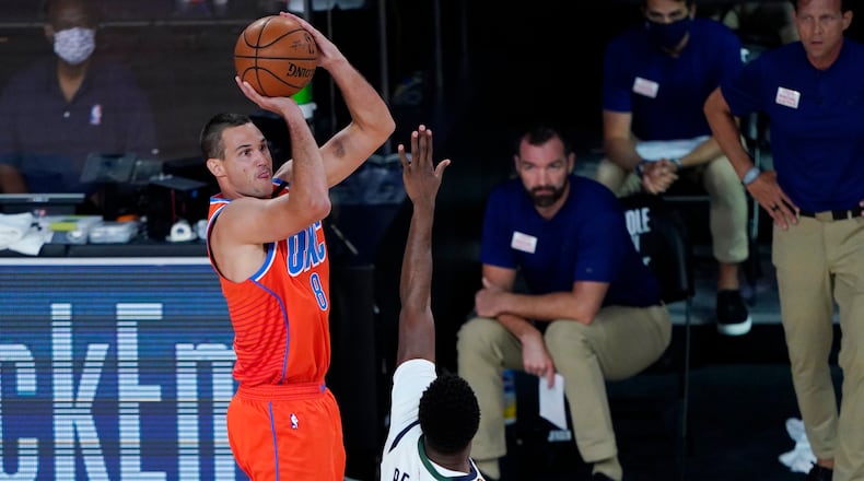 Oklahoma City Thunder's Danilo Gallinari (8) shoots over Utah Jazz's Emmanuel Mudiay (15) during the first half of an NBA basketball game Saturday, Aug. 1, 2020, in Lake Buena Vista, Fla. (AP Photo/Ashley Landis, Pool)