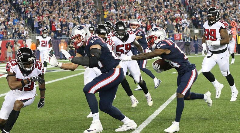 October 22, 2017 Foxborough: Patriots Brandon Cooks follows a block on Falcons Robert Alford into the endzone for a 7-0 lead during the first half in a NFL football game on Sunday, October 22, 2017, in Foxborough. Curtis Compton/ccompton@ajc.com