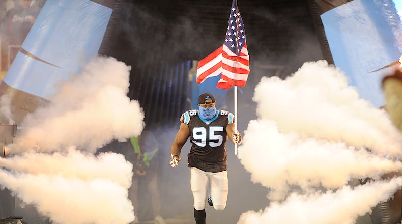 Carolina Panthers defensive end Charles Johnson (95) enters the field before an NFL football game between the Carolina Panthers and the Miami Dolphins in Charlotte, N.C., Monday, Nov. 13, 2017. (AP Photo/Mike McCarn)