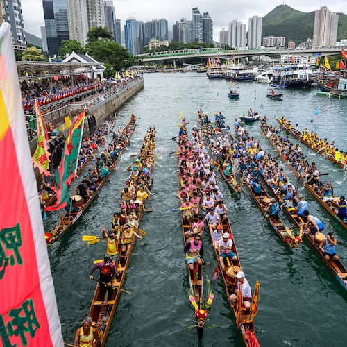 Competitors take part in the Aberdeen Dragon Boat Race to celebrate the Dragon Boat Festival in Hong Kong, Friday, June 19, 2026. (AP Photo/Chan Long Hei)