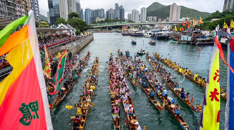 Competitors take part in the Aberdeen Dragon Boat Race to celebrate the Dragon Boat Festival in Hong Kong, Friday, June 19, 2026. (AP Photo/Chan Long Hei)