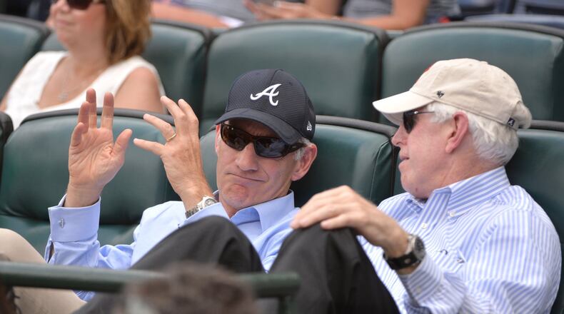 Liberty Media CEO Greg Maffei (left) and Atlanta Braves Chairman and CEO Terry McGuirk talk during a game against the Los Angeles Dodgers at Turner Field on April 21, 2016. Hyosub Shin / hshin@ajc.com