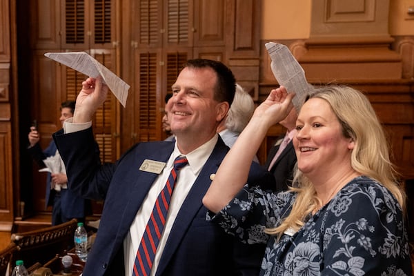 State Rep. Lehman Franklin, R-Statesboro, and Lorie Franklin toss paper airplanes on the final day of the legislative session in April at the Capitol in Atlanta.