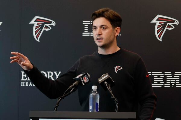 Falcons offensive coordinator Tommy Rees answers questions in Flowery Branch.
