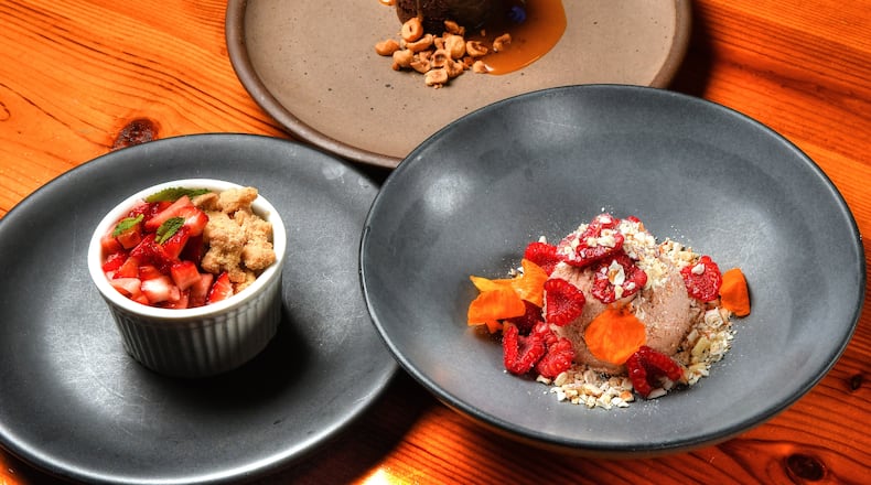 Miller Union pastry chef Claudia Martinez offers some spring-to-summer seasonal recipes: Gluten-Free Chocolate Cake With Salted Caramel and Candied Hazelnuts (top), Meyer Lemon Semifreddo With Oat Cookie Crumble and Macerated Strawberries (bottom left), and Raspberry Cheesecake Mousse With Pretzel Crunch (bottom right). Styling by Claudia Martinez / Chris Hunt for the AJC