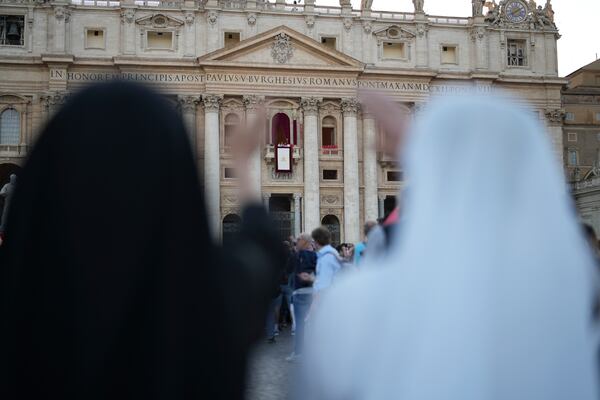 Nuns react during the speech of the newly elected Pope Leo XIV at the Vatican, Thursday, May 8, 2025. (AP Photo/Francisco Seco)